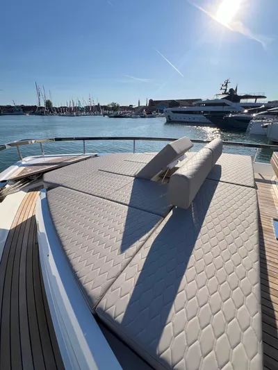  Yacht Photos Pics 2025 Astondoa AS 8 yacht with sun deck, docked in a marina under clear skies.