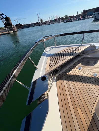  Yacht Photos Pics Astondoa AS 8 yacht deck, 2025 model, docked in a marina with clear skies.