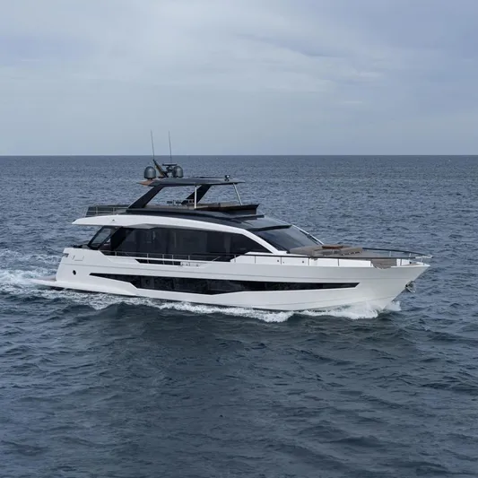  Yacht Photos Pics 2025 Astondoa AS 8 yacht cruising on open sea under cloudy sky.