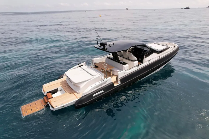 Rebel 47 Yacht Photos Pics 2025 SACS Rebel 47 luxury yacht on open water, featuring sleek design and spacious deck.