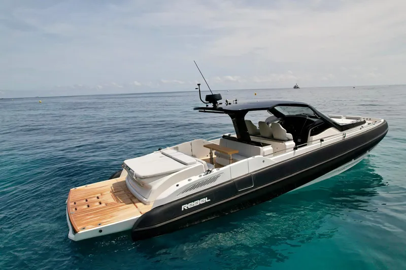 Rebel 47 Yacht Photos Pics 2025 SACS Rebel 47 luxury yacht on clear blue water.