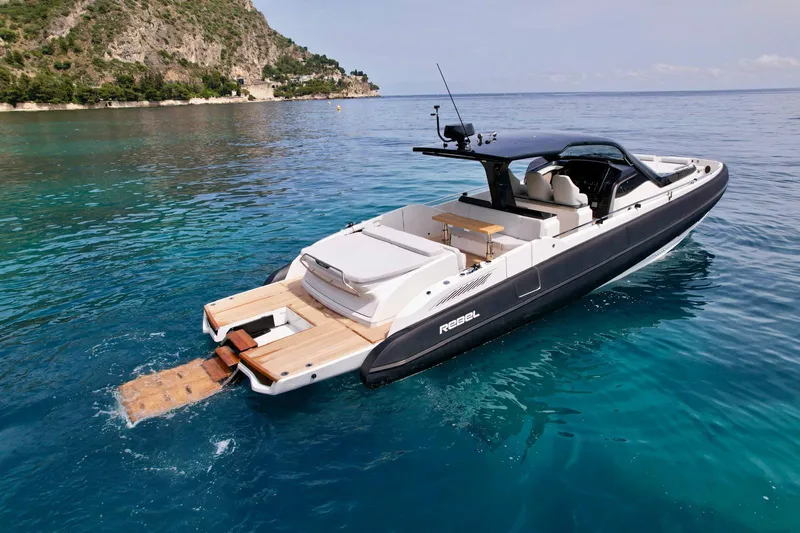 Rebel 47 Yacht Photos Pics 2025 SACS Rebel 47 yacht on clear blue water, featuring sleek design and luxurious amenities.