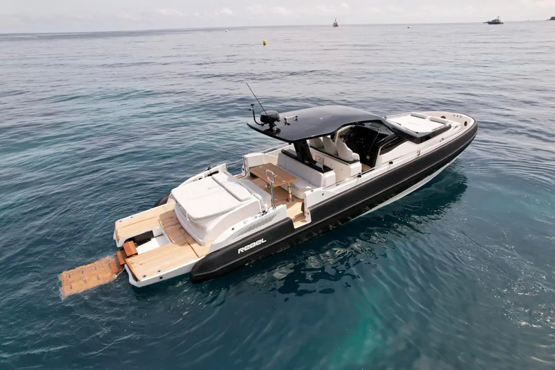 Rebel 47 Yacht Photos Pics 2025 SACS Rebel 47 luxury yacht on calm ocean waters.