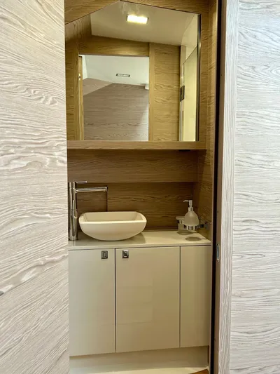 Rebel 47 Yacht Photos Pics Modern bathroom interior on 2025 SACS Rebel 47 yacht, featuring sleek design and elegant fixtures.