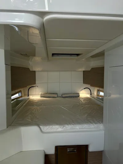 Rebel 47 Yacht Photos Pics Interior cabin of 2025 SACS Rebel 47 yacht, featuring a cozy bed and modern design.