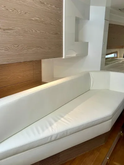 Rebel 47 Yacht Photos Pics Luxurious interior of 2025 SACS Rebel 47 yacht with white leather seating.