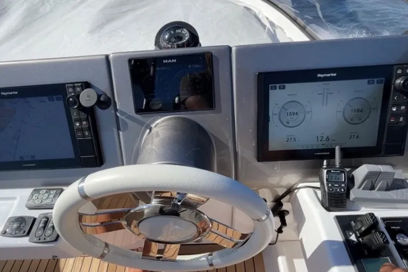  Yacht Photos Pics Cockpit of 2022 Azimut Magellano 66 yacht with advanced navigation systems.