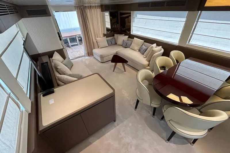  Yacht Photos Pics Luxurious interior of 2022 Azimut Magellano 66 yacht with elegant seating and dining area.