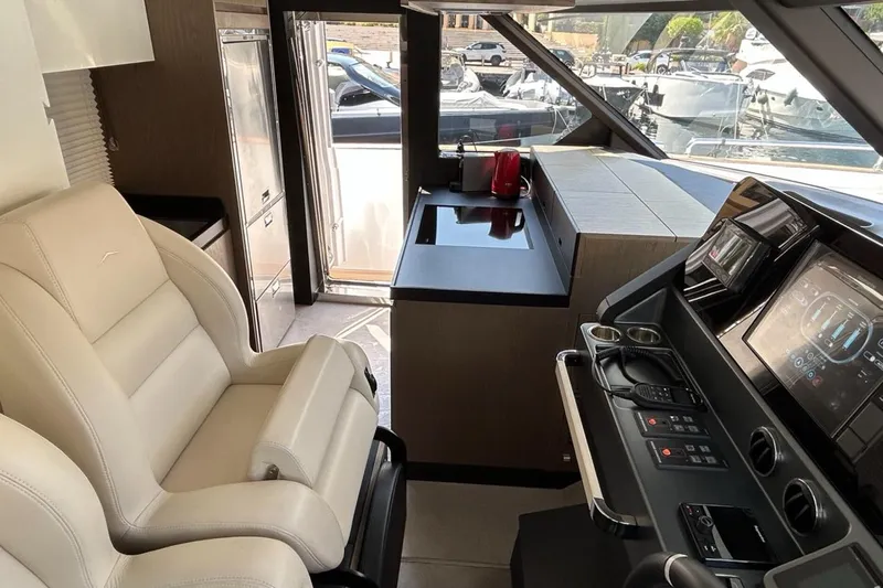  Yacht Photos Pics Interior of 2022 Azimut Magellano 66 yacht with modern helm and seating.