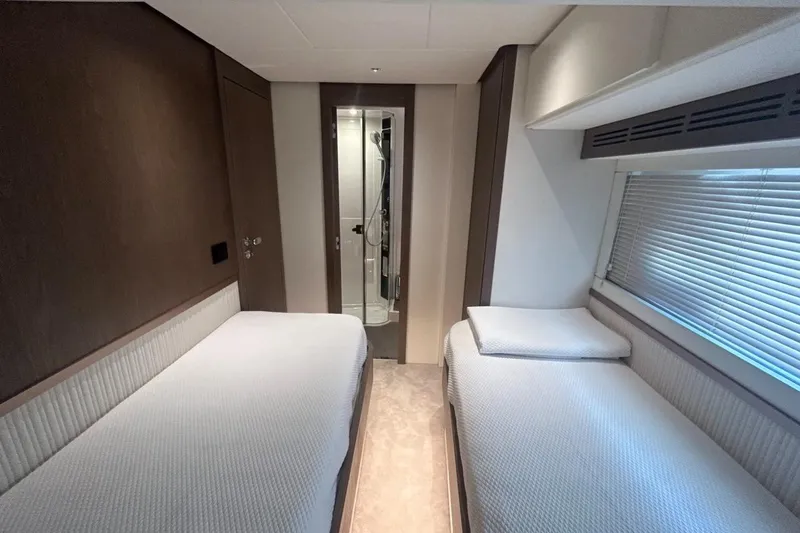  Yacht Photos Pics Interior of 2022 Azimut Magellano 66 yacht with twin beds and modern decor.