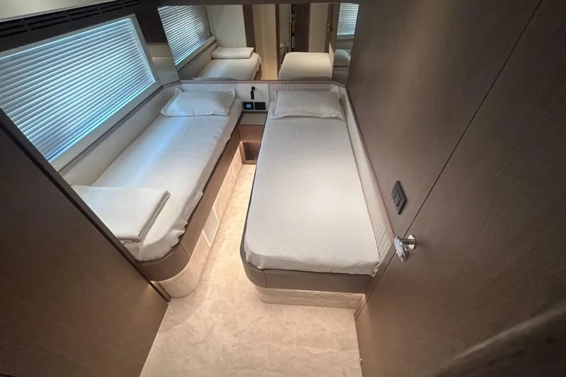  Yacht Photos Pics Interior of 2022 Azimut Magellano 66 yacht with twin beds and modern design.