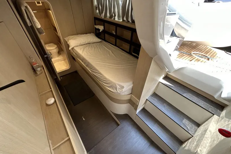  Yacht Photos Pics Azimut Magellano 66 (2022) interior cabin with bed and bathroom.