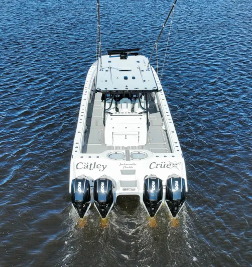  Yacht Photos Pics Invincible 40 Catamaran 2022 on water, featuring four powerful outboard engines.