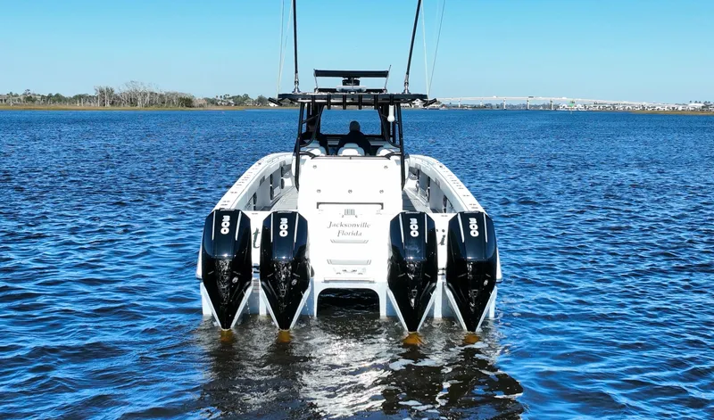  Yacht Photos Pics 2022 Invincible 40 Catamaran with four powerful engines on open water.