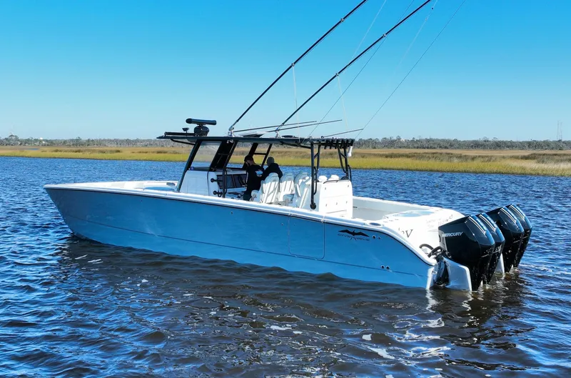  Yacht Photos Pics 2022 Invincible 40 Catamaran on water, featuring sleek design and powerful engines.