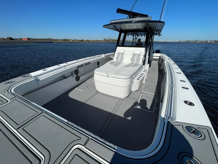  Yacht Photos Pics 2022 Invincible 40 Catamaran on water, showcasing spacious deck and sleek design.