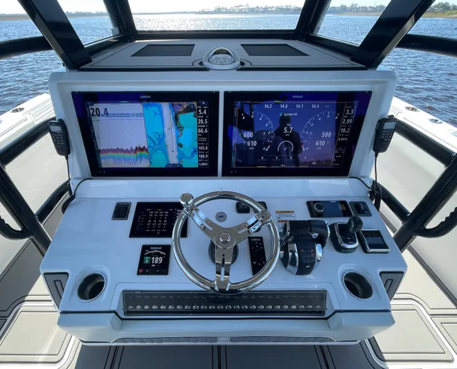  Yacht Photos Pics 2022 Invincible 40 Catamaran helm with dual displays and advanced navigation controls.
