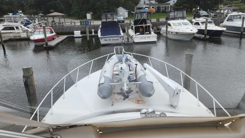 Endurance Yacht Photos Pics 2001 Ocean Yachts 56 Super Sport docked with inflatable boat on deck.