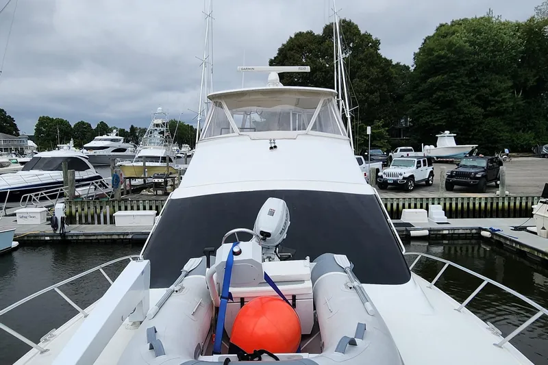 Endurance Yacht Photos Pics 2001 Ocean Yachts 56 Super Sport docked with inflatable boat on deck.