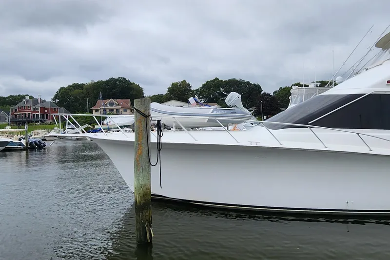 Endurance Yacht Photos Pics 2001 Ocean Yachts 56 Super Sport docked in a marina with overcast skies.