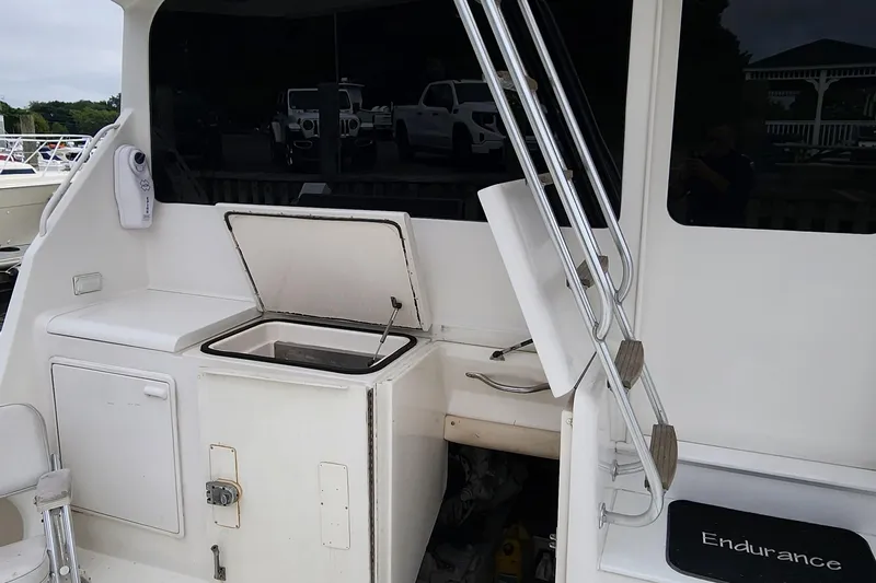 Endurance Yacht Photos Pics 2001 Ocean Yachts 56 Super Sport boat deck with storage compartments and ladder.