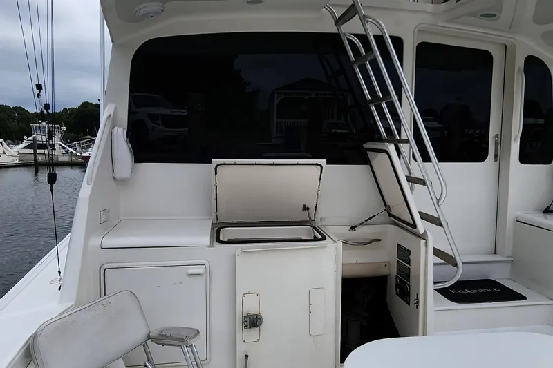 Endurance Yacht Photos Pics 2001 Ocean Yachts 56 Super Sport yacht deck with seating and ladder.