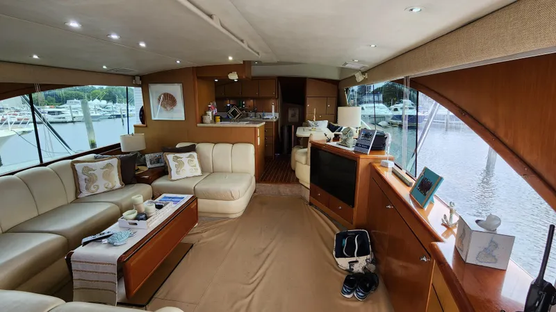 Endurance Yacht Photos Pics Luxurious interior of a 2001 Ocean Yachts 56 Super Sport with elegant furnishings and marina view.