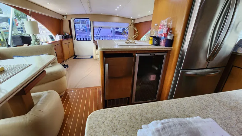 Endurance Yacht Photos Pics Interior of 2001 Ocean Yachts 56 Super Sport, featuring modern kitchen and seating area.