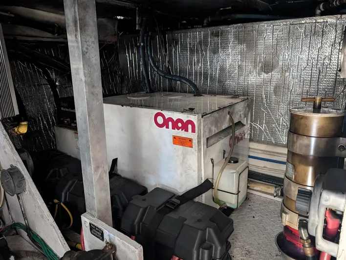 The Last Run Yacht Photos Pics Engine room of 2003 Cruisers Yachts 5000 Sport Sedan with Onan generator.