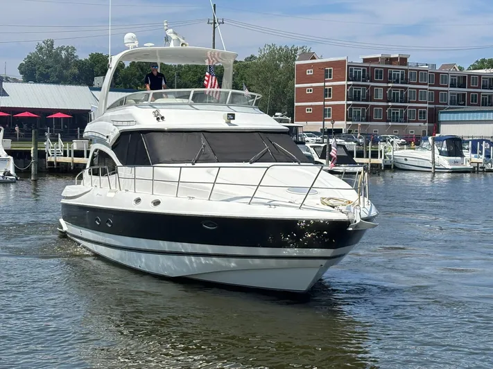 The Last Run Yacht Photos Pics 2003 Cruisers Yachts 5000 Sport Sedan in marina, featuring sleek design and modern amenities.