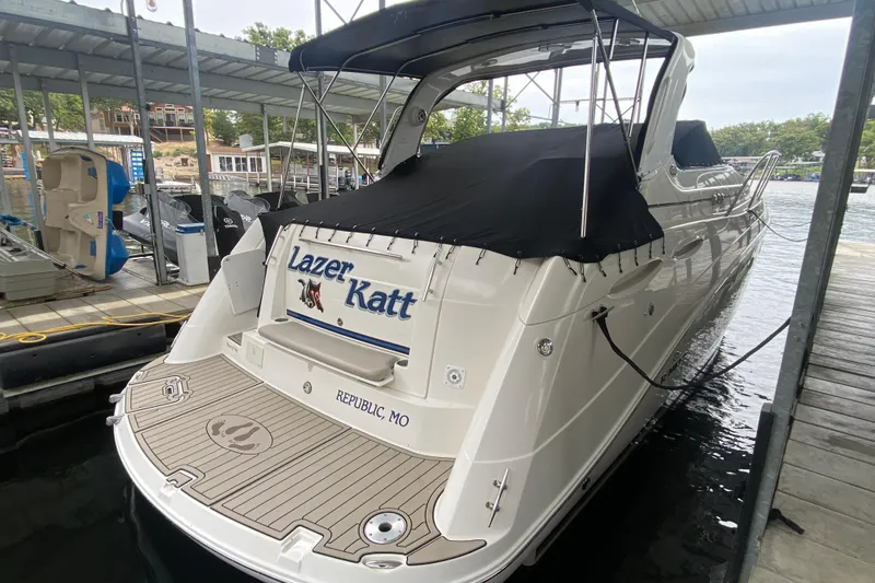  Yacht Photos Pics 2008 Rinker 350 Express Cruiser docked, covered, with "Lazer Katt" name visible.