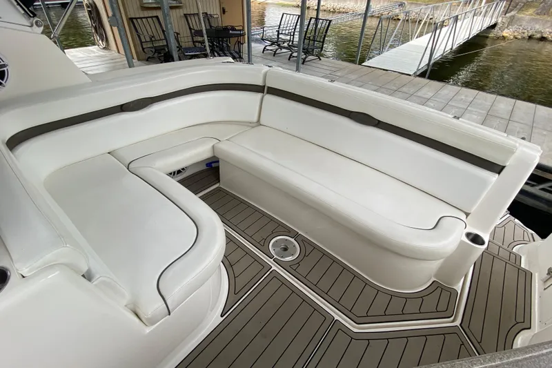  Yacht Photos Pics 2008 Rinker 350 Express Cruiser interior with white seating and teak-style flooring.