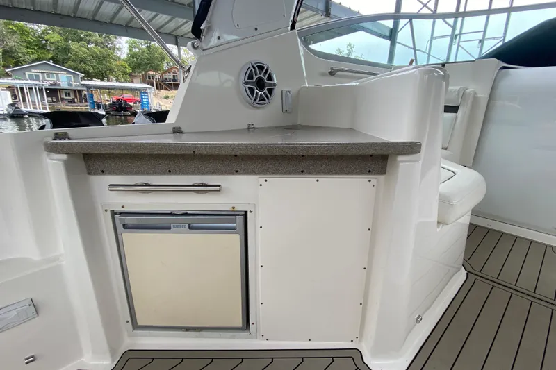  Yacht Photos Pics 2008 Rinker 350 Express Cruiser interior with kitchenette and seating area.