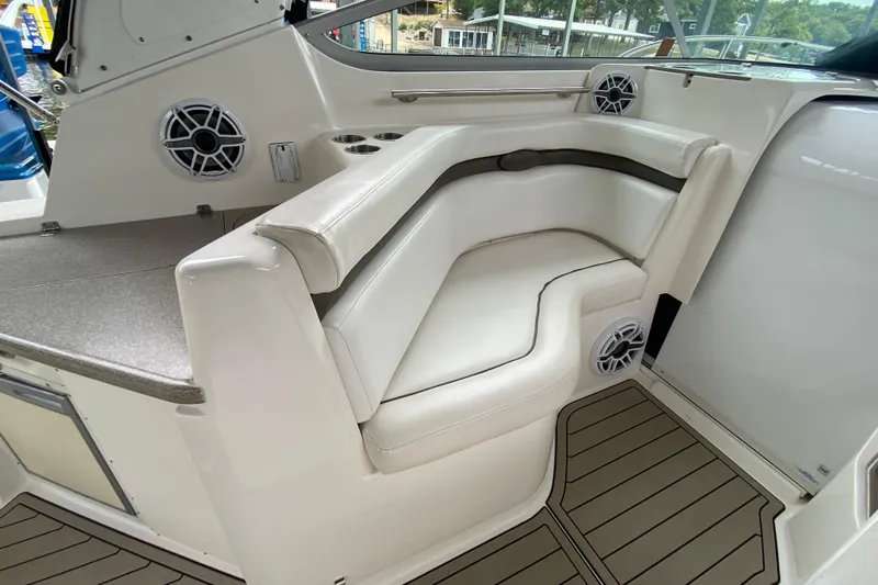  Yacht Photos Pics 2008 Rinker 350 Express Cruiser interior with white seating and marine speakers.