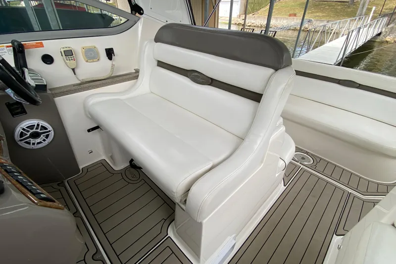  Yacht Photos Pics 2008 Rinker 350 Express Cruiser interior with white seating and control panel.