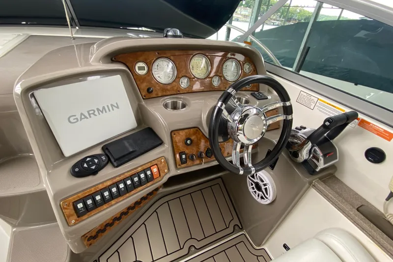 Yacht Photos Pics 2008 Rinker 350 Express Cruiser helm with Garmin navigation and wood-accented dashboard.