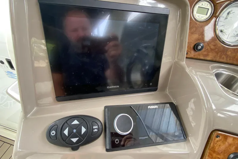  Yacht Photos Pics Dashboard of a 2008 Rinker 350 Express Cruiser with Garmin and Fusion displays.