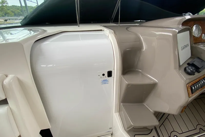  Yacht Photos Pics 2008 Rinker 350 Express Cruiser helm with Garmin navigation system and sleek interior design.
