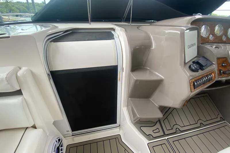  Yacht Photos Pics 2008 Rinker 350 Express Cruiser helm with Garmin navigation and cabin entry.