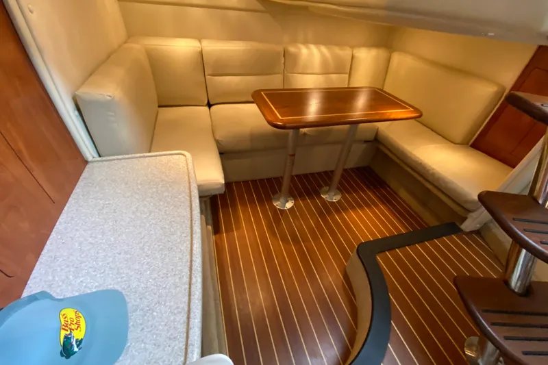  Yacht Photos Pics 2008 Rinker 350 Express Cruiser interior with cozy seating and wooden table.