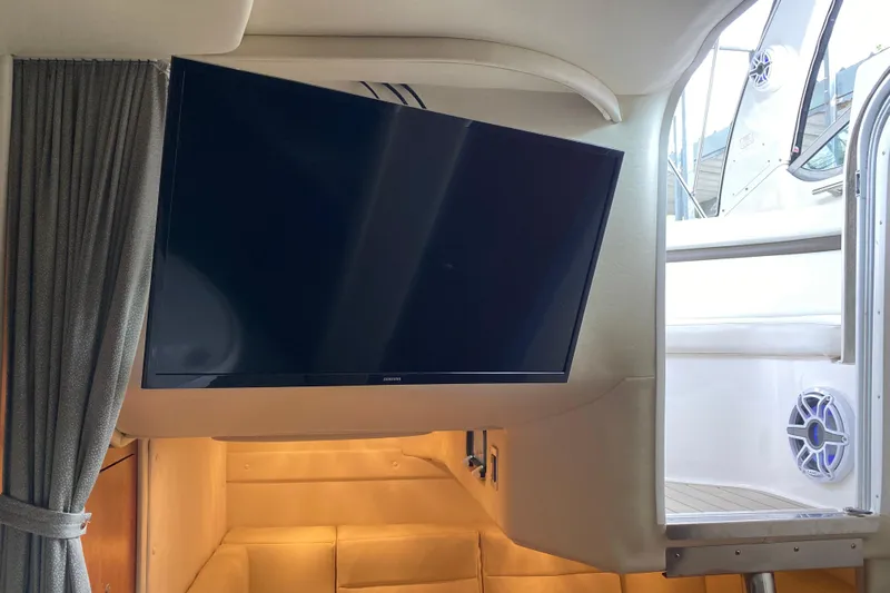  Yacht Photos Pics Interior of 2008 Rinker 350 Express Cruiser with mounted TV and cozy seating area.