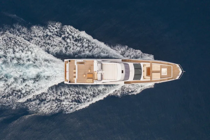 Sama Yacht Photos Pics Aerial view of 2017 Azimut Grande 35 Metri yacht cruising on open water.