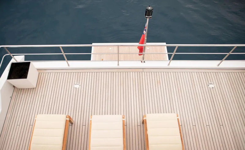 Sama Yacht Photos Pics Deck of 2017 Azimut Grande 35 Metri yacht with loungers and railing.