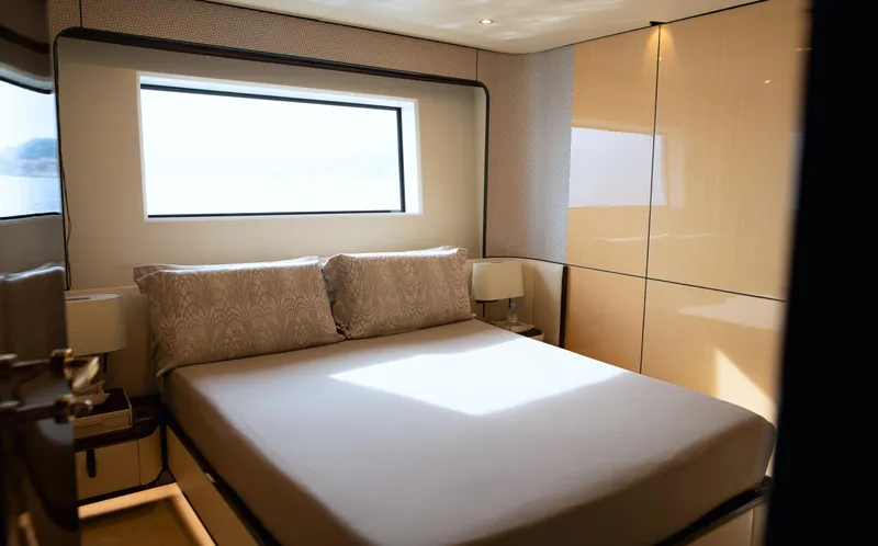 Sama Yacht Photos Pics Luxurious bedroom interior of 2017 Azimut Grande 35 Metri yacht, featuring elegant design and natural light.