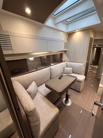  Yacht Photos Pics 2023 Cranchi M 44 HT yacht interior with modern seating and skylights.