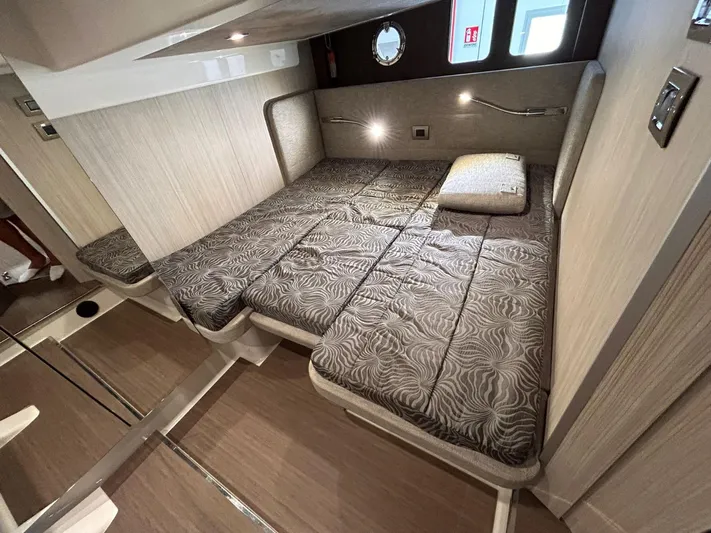  Yacht Photos Pics 2023 Cranchi M 44 HT cabin interior with modern bedding and sleek design.
