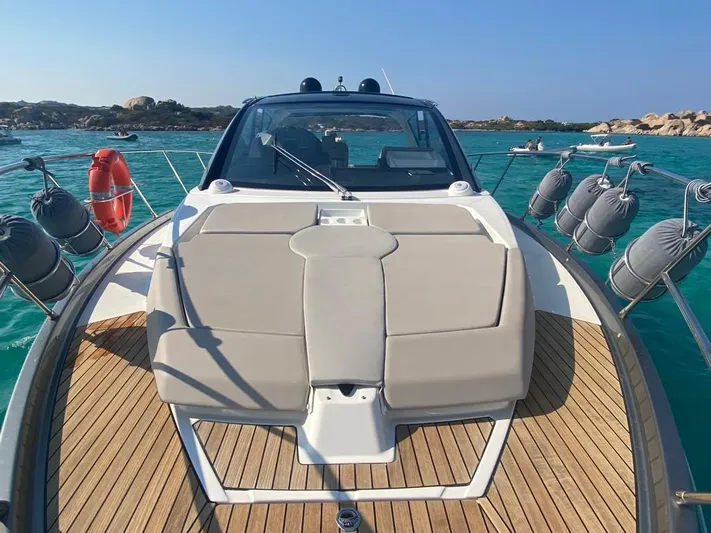 Yacht Photos Pics 2023 Cranchi M 44 HT yacht on turquoise water, featuring sleek deck design.