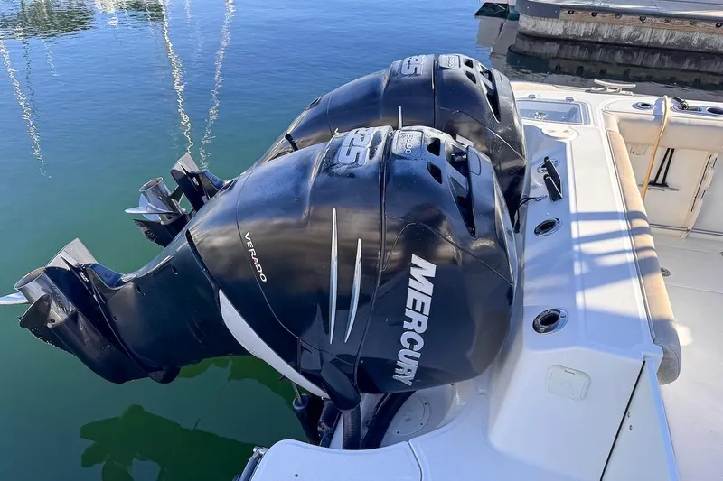Libres Y Lokos Yacht Photos Pics Twin Mercury Verado engines on a 2016 Boston Whaler 285 Conquest boat at the dock.