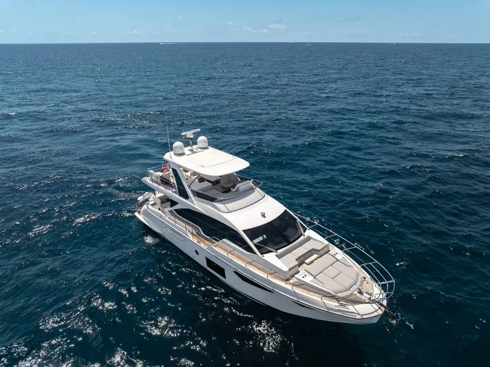  Yacht Photos Pics 2022 Azimut Fly 60 yacht cruising on open ocean waters.