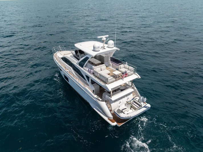  Yacht Photos Pics Azimut Fly 60 yacht cruising on open sea, 2022 model, aerial view.
